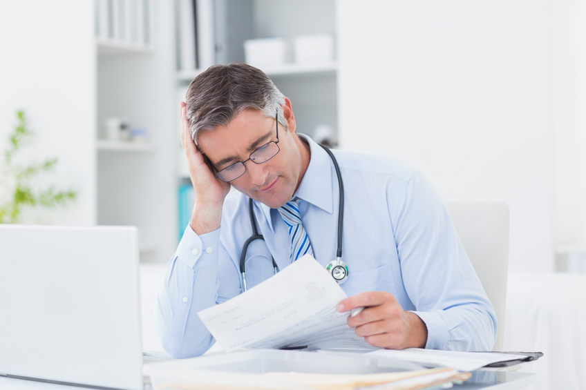 doctor looking at records