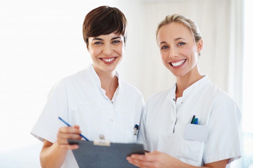 two doctors looking at clipboard